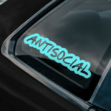 Teal 'ANTISOCIAL' sticker on a car window