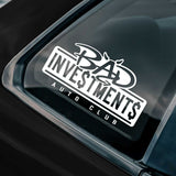 Sticker on a car window with 'Bad Investments Auto Club' text