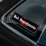 Sticker with 'Bad Investments' text on a car window