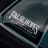 Car window with a two-colour 'False Hopes' decal