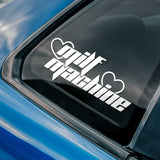 Car window with a 'MILF Machine' decal on a blue car
