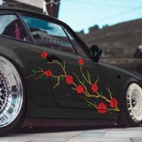 Black car with red rose floral design on a blurred background