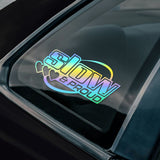 Holographic 'Slow & Proud' sticker on a car window