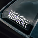 Car window with 'alive after MIDNIGHT' decal on a car window