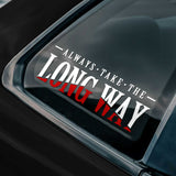 Sticker with 'Always take the long way' text on a car window