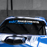 A blue vehicle windshield banner with the text 'BAD Investments Auto Club' displayed on it.