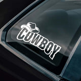 Car window with a white 'Cowboy' decal.