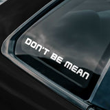 Car window with a decal that reads 'DON'T BE MEAN'.