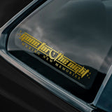 Side view of car with a gold decal on the window