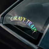 Car window with 'Gravy Train' sticker 