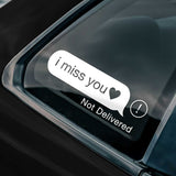Sticker on a car window with 'i miss you' text and 'Not Delivered' notification.
