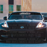 Alive After Midnight Windshield Banner Decal by Bad Investments Auto Club shown on a Nissan 350Z car.