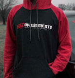 Male model wearing a charcoal and red pullover hooded sweater with “Bad Investments Good Intentions” design