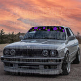 Rose branches and thorn windshield sticker design on front of a BMW car