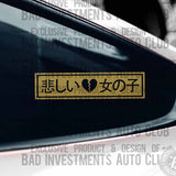 Sad Girl written in Japanese lettering with broken heart symbol sticker on car window by Bad Investments Auto