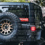 Send Nudes with English and Japanese lettering sticker on Jeep rear window