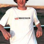 Male model wearing a white tshirt of the Bad Investments Good Intentions design