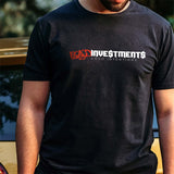 Male model wearing a black tshirt of the Bad Investments Good Intentions design